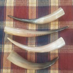 4 drinking horns on tartan