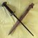 dagger with scabbard on yellow background