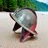 morion helmet on beach with jungle in background